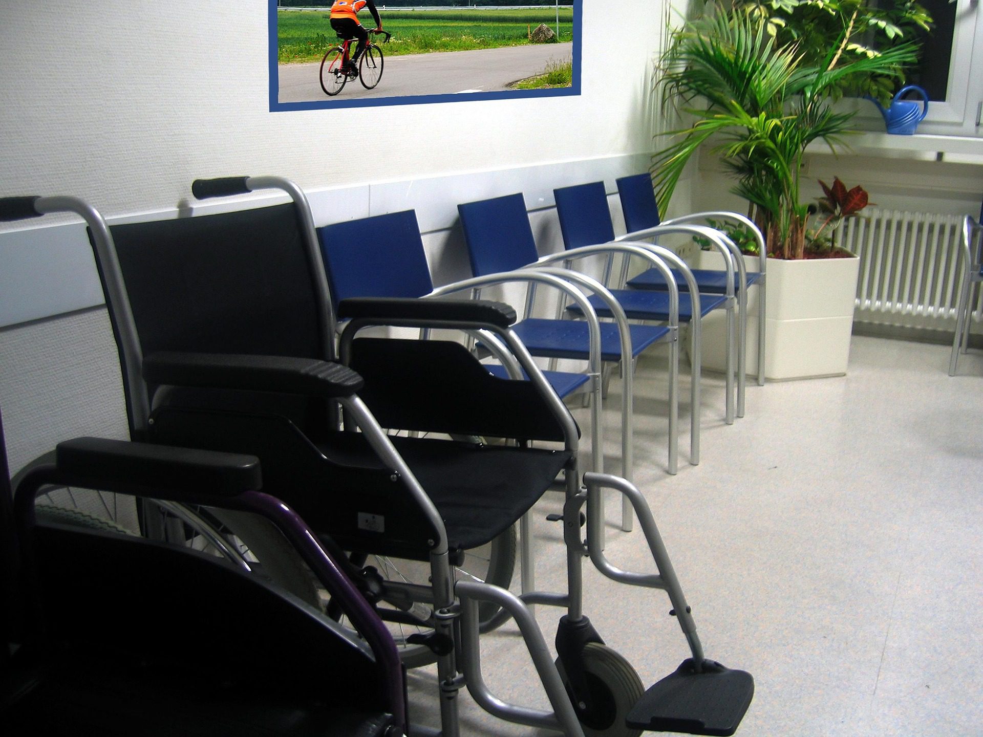Waiting room with chairs and wheelchairs.